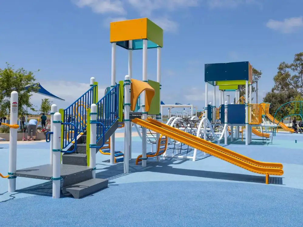 orange playground slide on blue floor